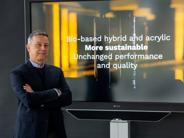 Man in front of a television screen with a prompt on it